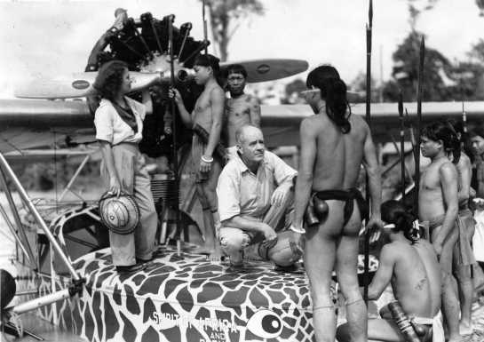 Explorers Martin and Osa Johnson with their craft “The Spirit of Africa and Borneo” confront Marut tribesmen while on Safari, circa 1935.