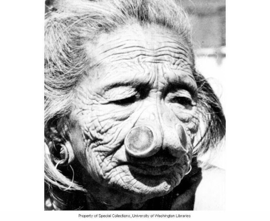 109 year old Apatani woman of slave class with nose plugs, Subansiri Frontier District, India, ca. 1954